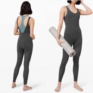Lululemon black bodysuit with laser cut outs, rare size 6 yoga